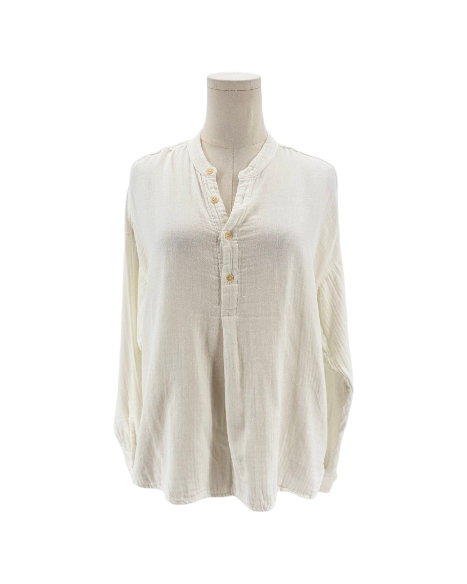 White button-up shirt on a mannequin against a white background