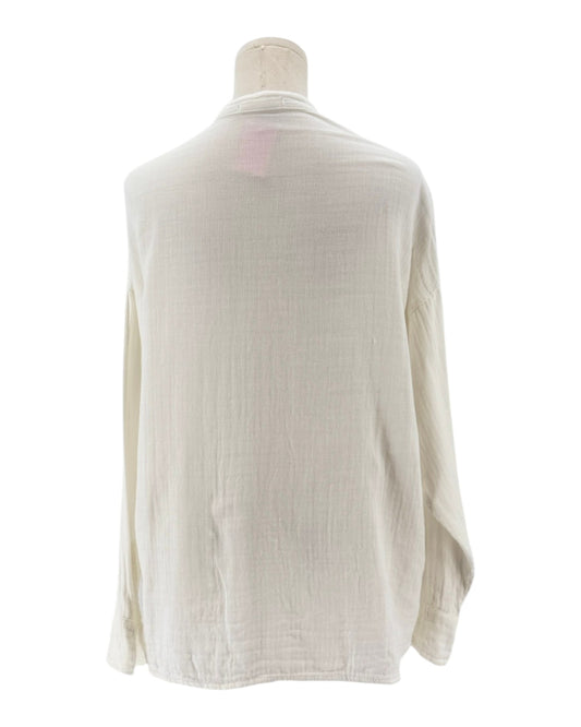 Beige cardigan on a mannequin against a white background