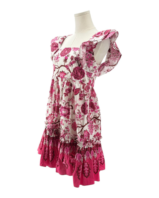 Pink floral dress on a mannequin against a white background