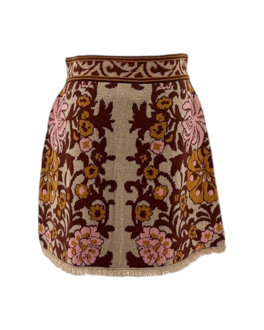 Floral patterned skirt with brown and pink colors on a white background