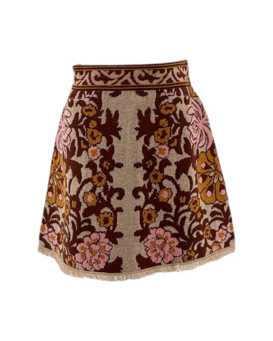 Floral patterned skirt with brown and pink colors on a white background