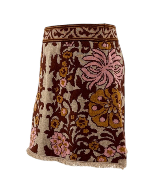 Floral patterned skirt with brown and pink colors on a white background