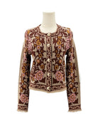 Floral patterned jacket on a mannequin against a white background