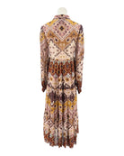 Patterned dress on a mannequin against a white background