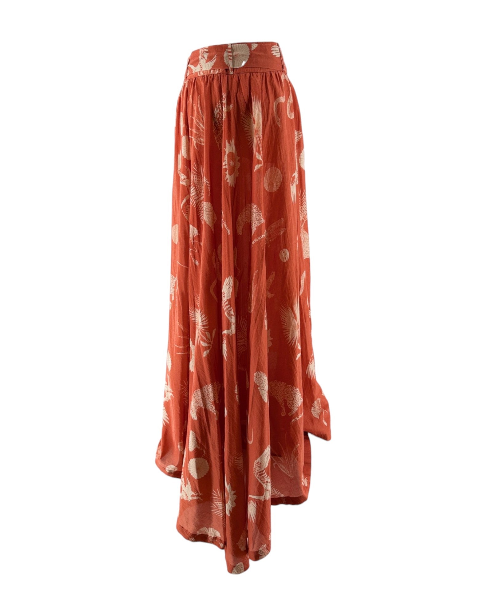 Long orange skirt with white floral pattern on a white background