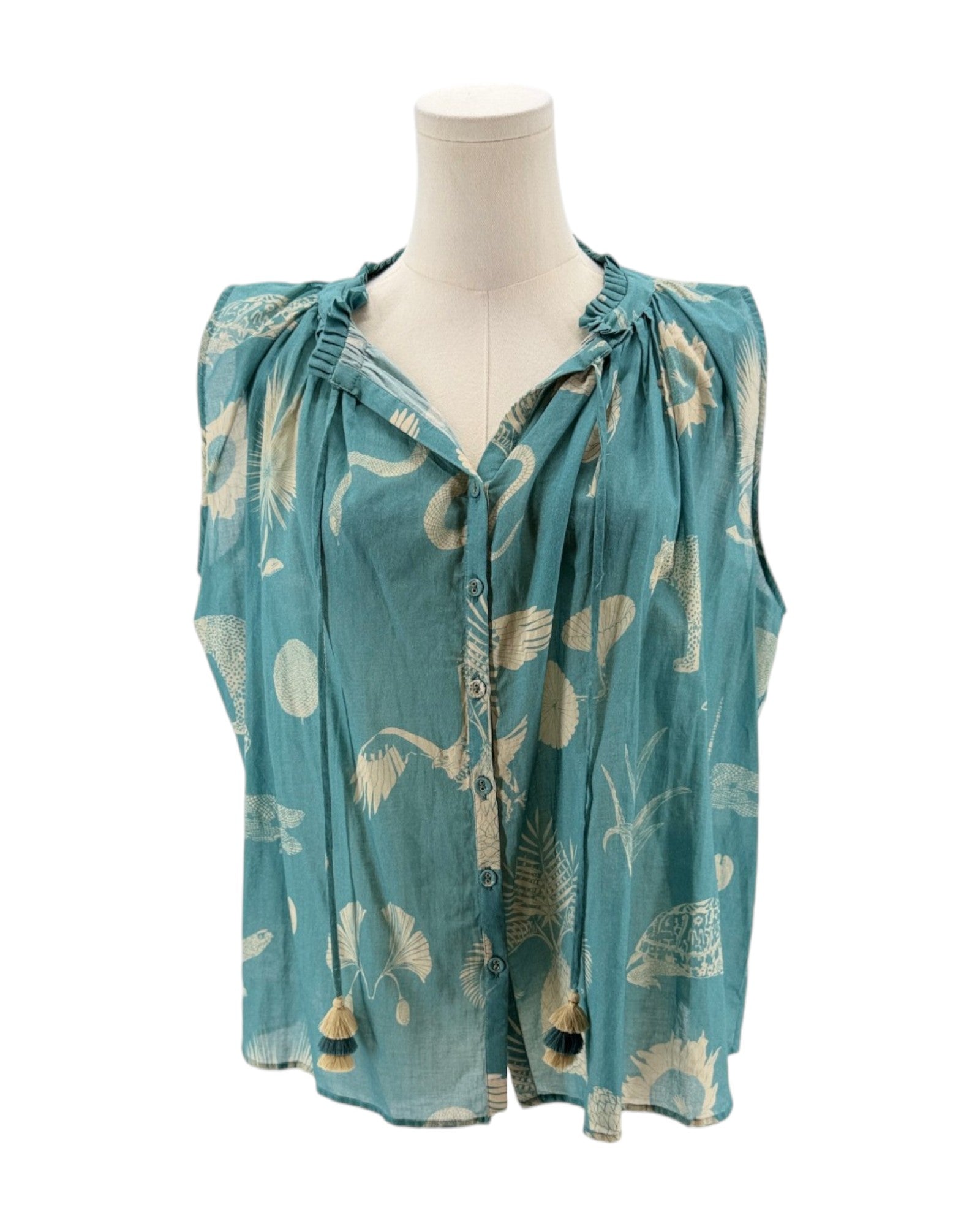 Teal sleeveless top with floral pattern on a mannequin against a white background