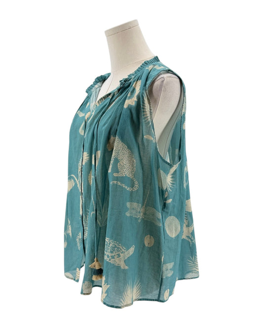 Teal blouse with animal pattern on a mannequin against a white background