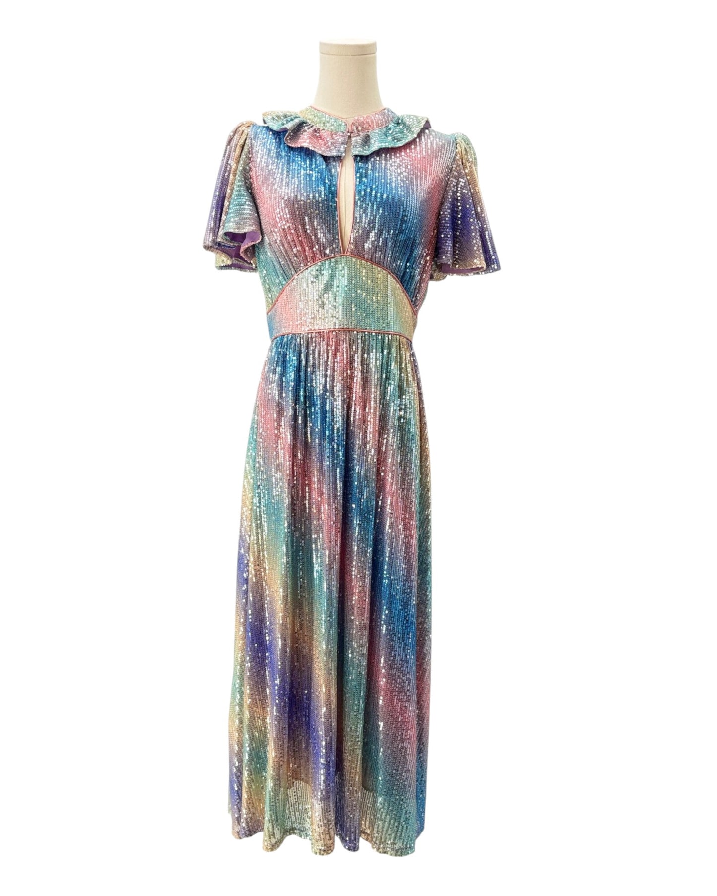 Multicolored dress on a mannequin against a white background