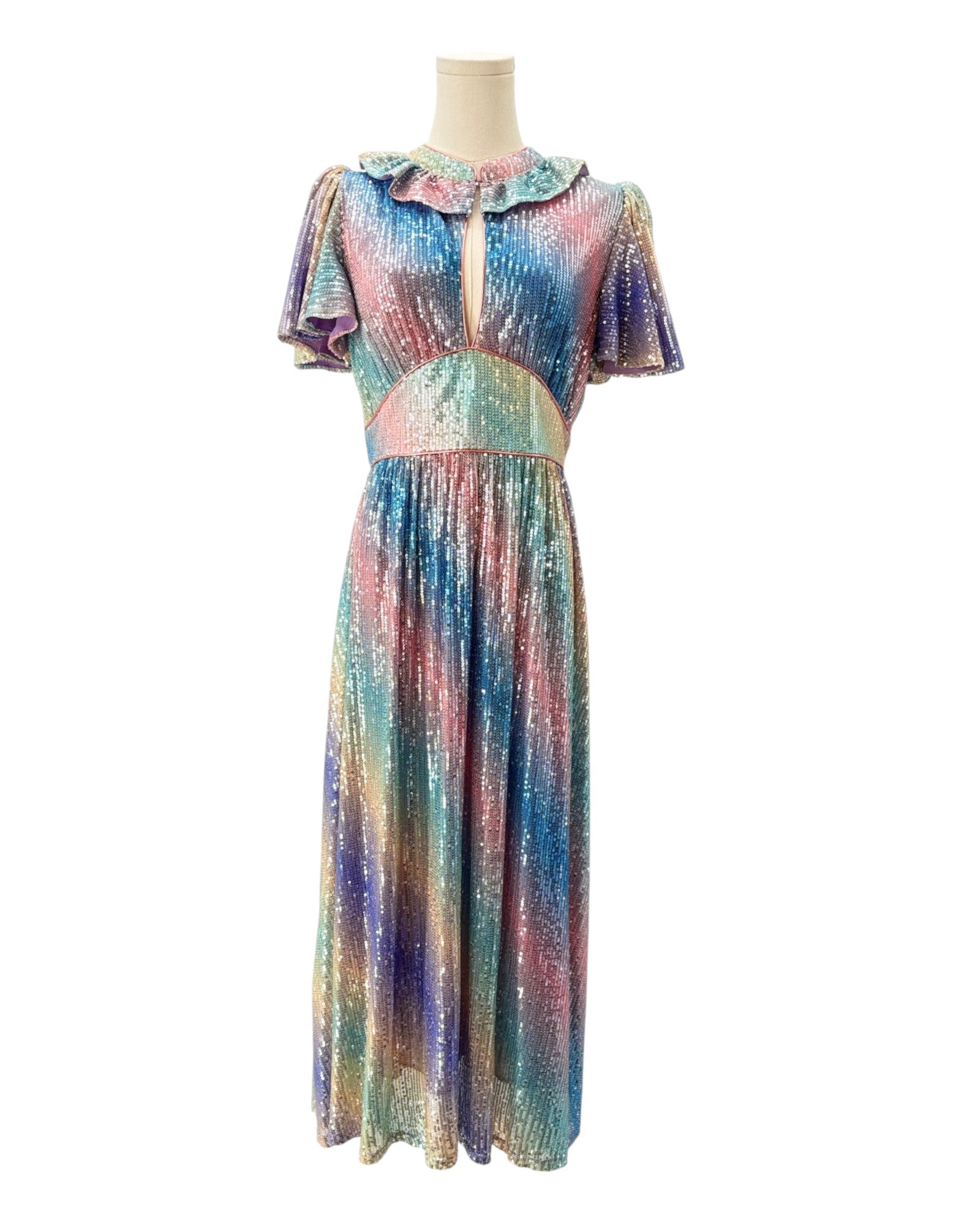 Multicolored dress on a mannequin against a white background