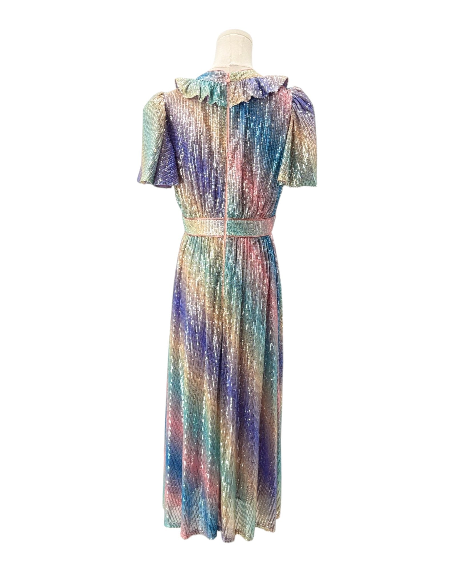 Multicolored dress on a mannequin against a white background