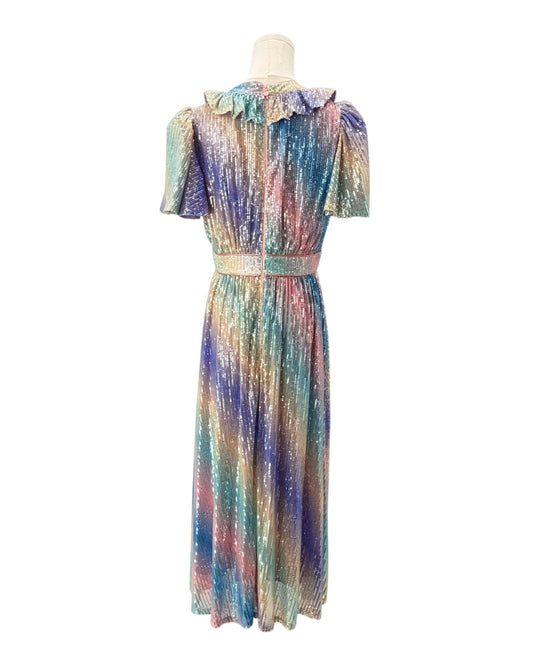 Multicolored dress on a mannequin against a white background