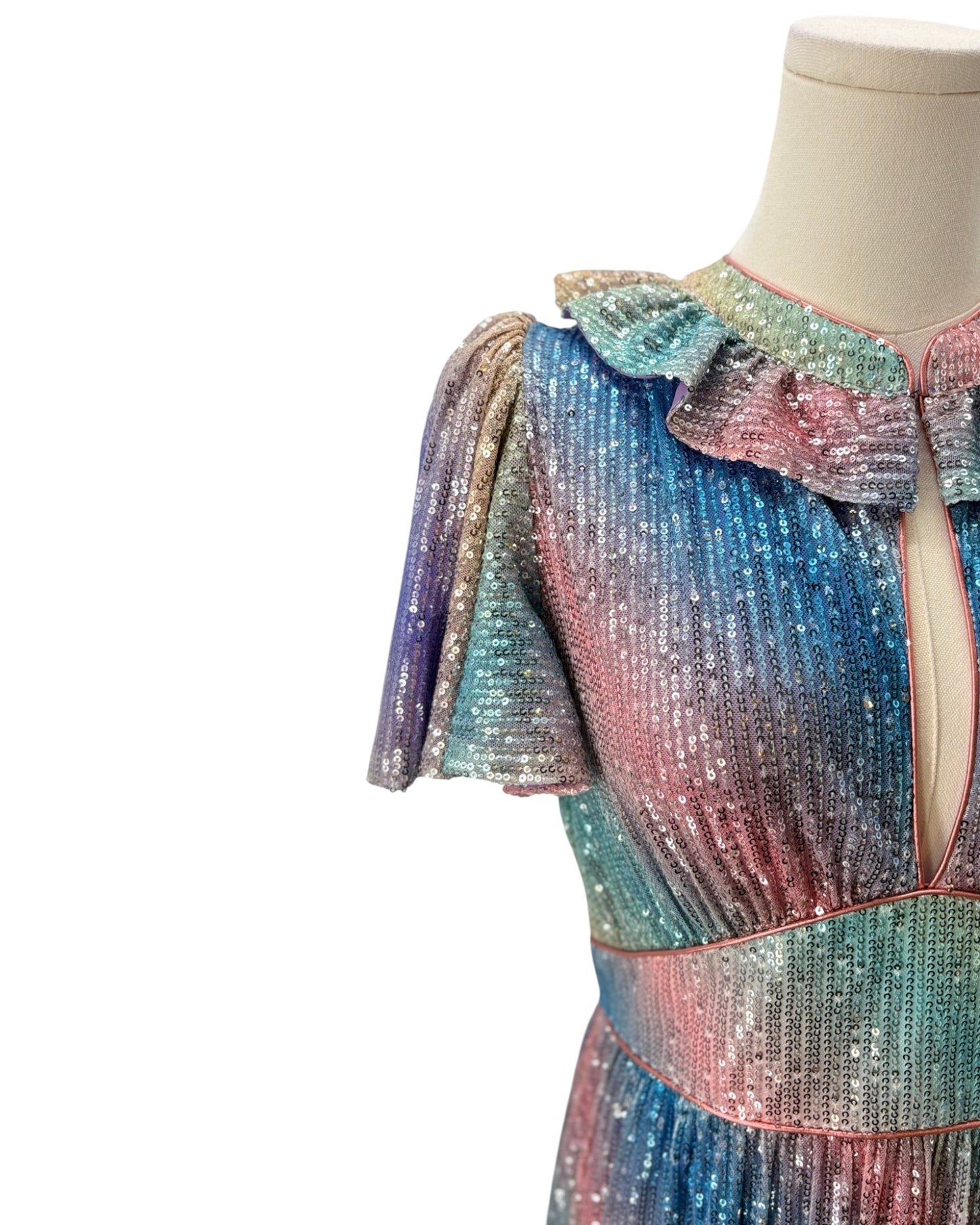 Multicolored sequin dress on a mannequin against a white background