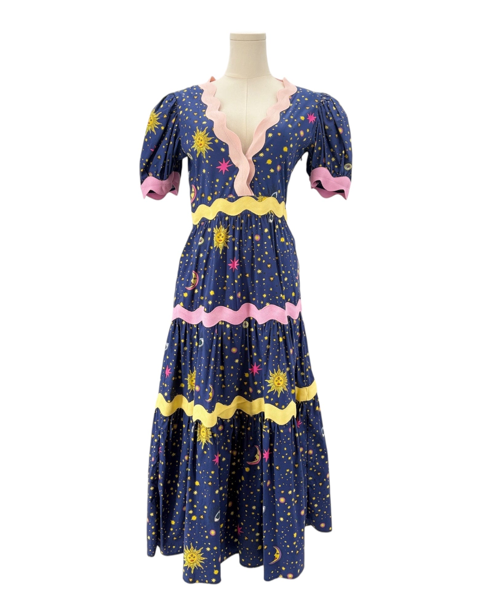 Celia B Navy dress with celestial pattern on a mannequin against a white background