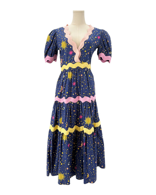Celia B Navy dress with celestial pattern on a mannequin against a white background
