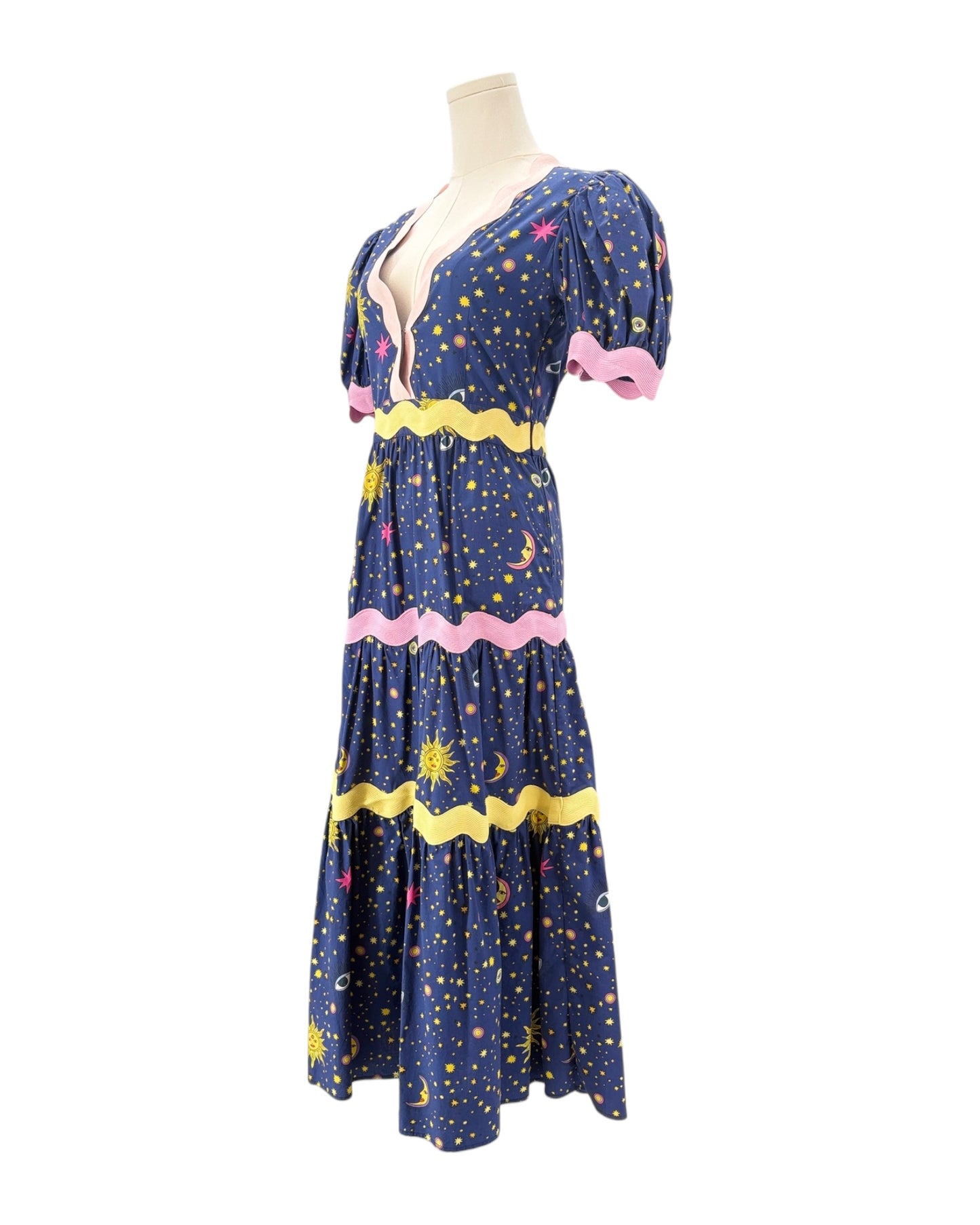 Celia B Navy dress with celestial pattern on a mannequin against a white background