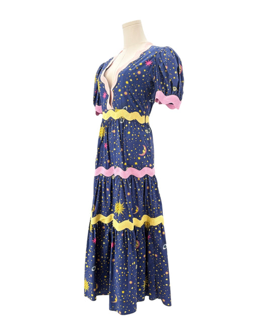 Celia B Navy dress with celestial pattern on a mannequin against a white background