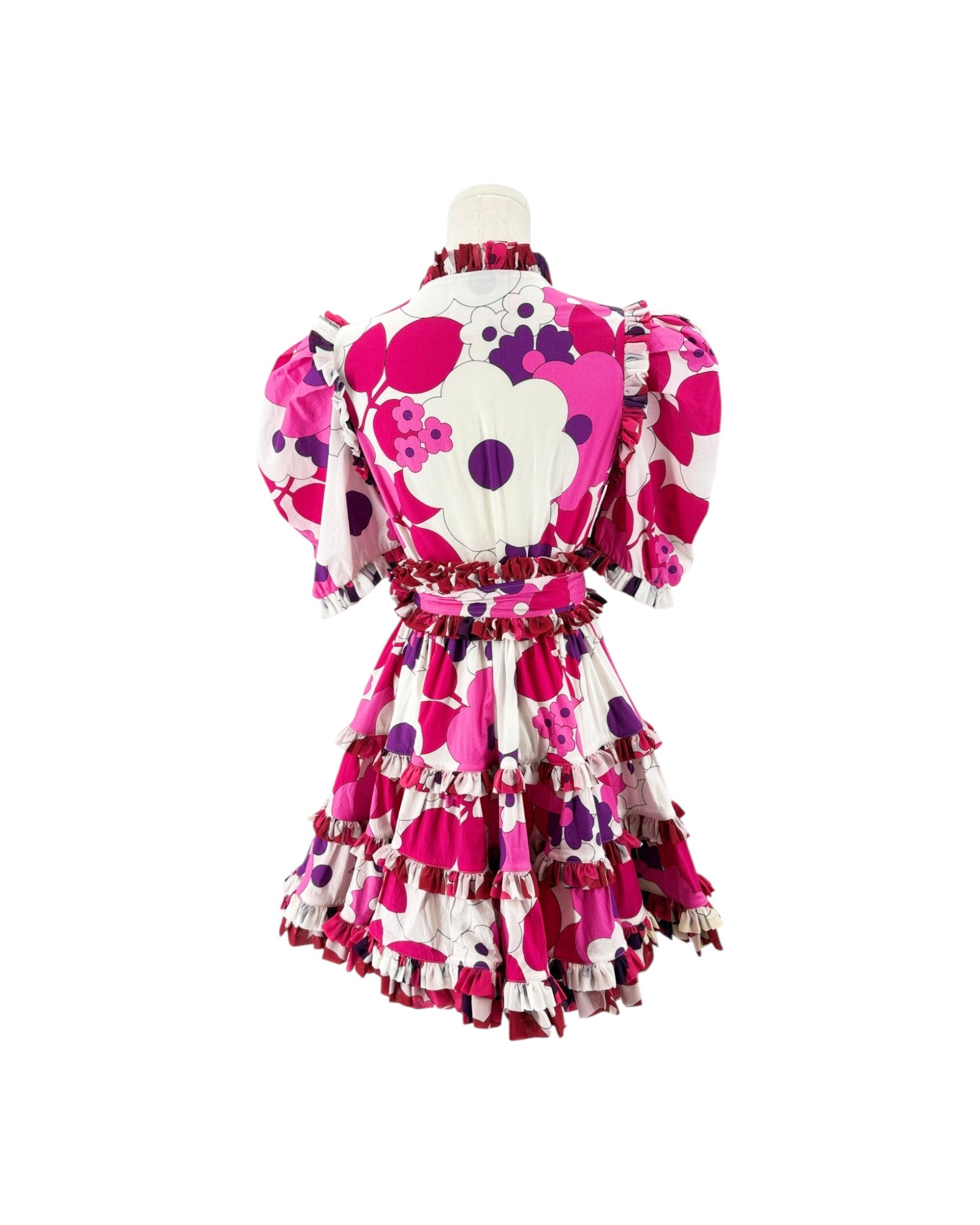 A pink, white, and purple floral-patterned ruffled dress displayed on a mannequin from the back against a plain white background.