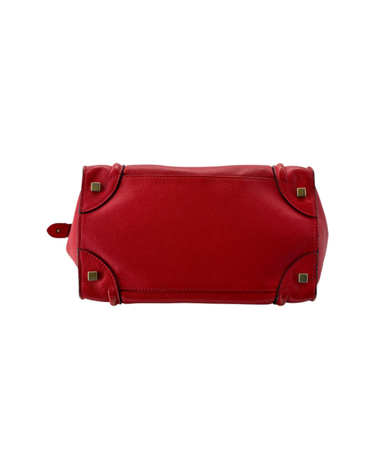 Red handbag with gold accents on a white background