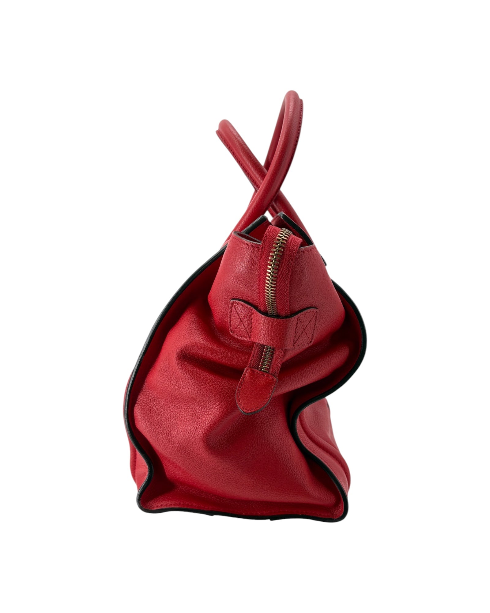 Red handbag with a gold zipper on a white background