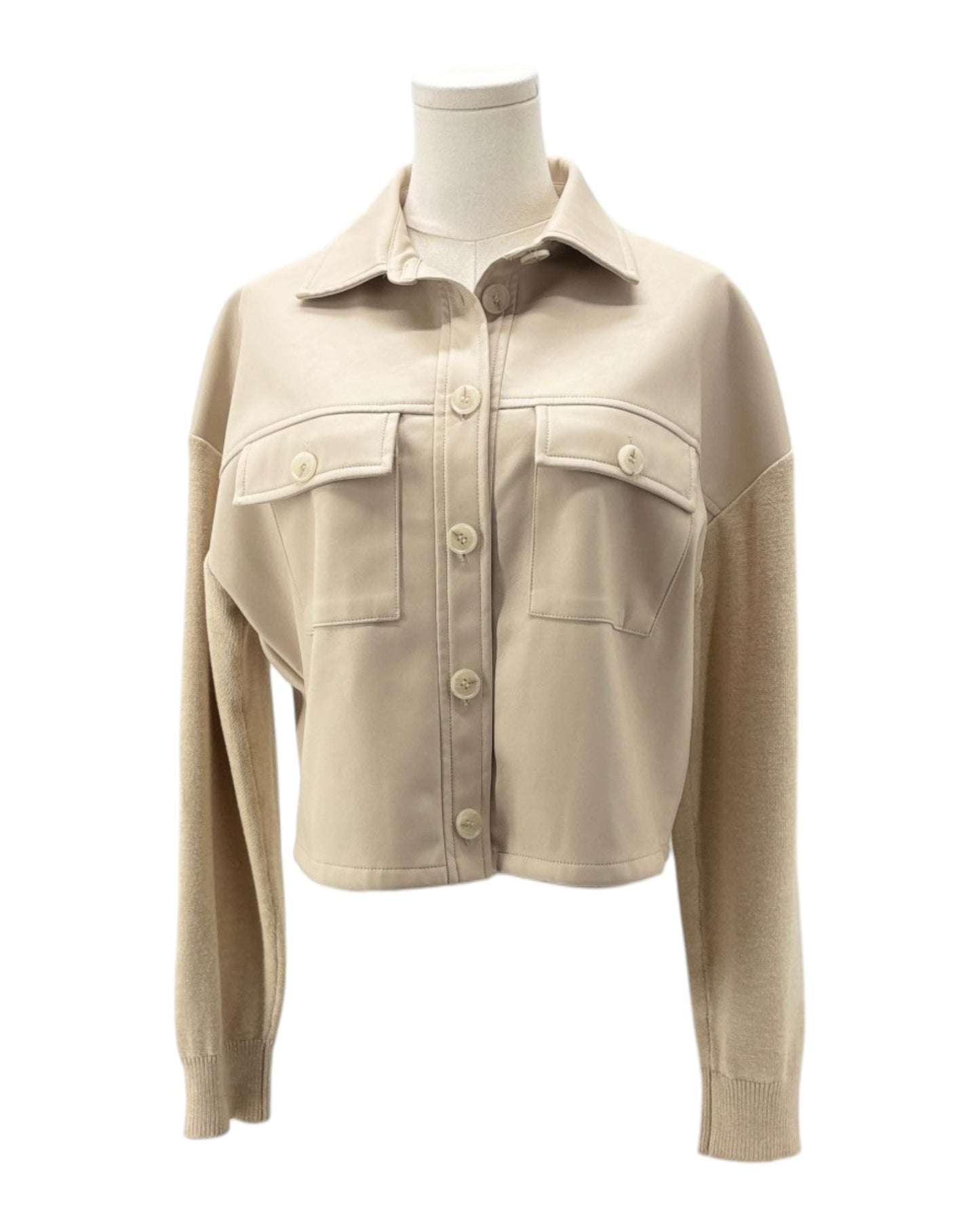 Beige jacket on a mannequin against a white background