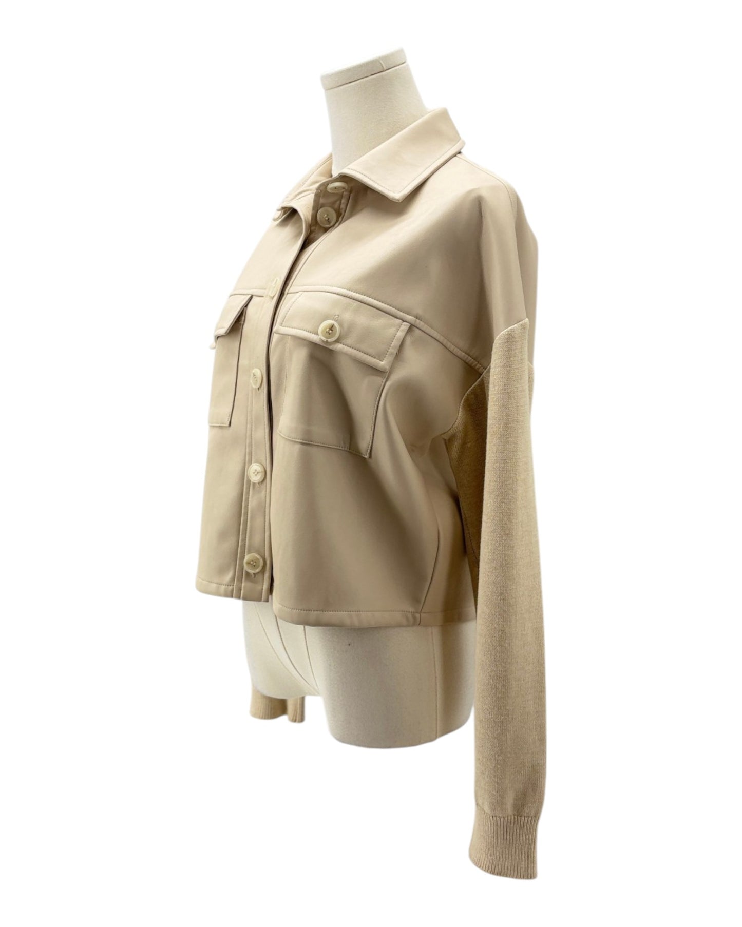 Beige jacket on a mannequin against a white background