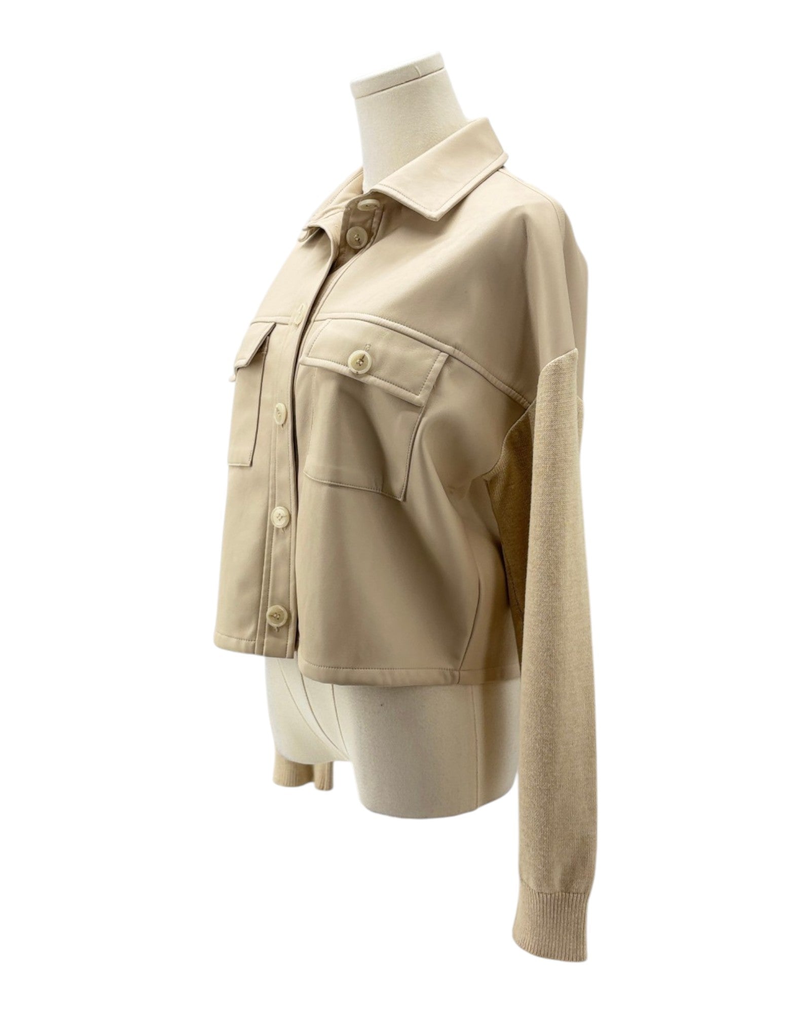 Beige jacket on a mannequin against a white background
