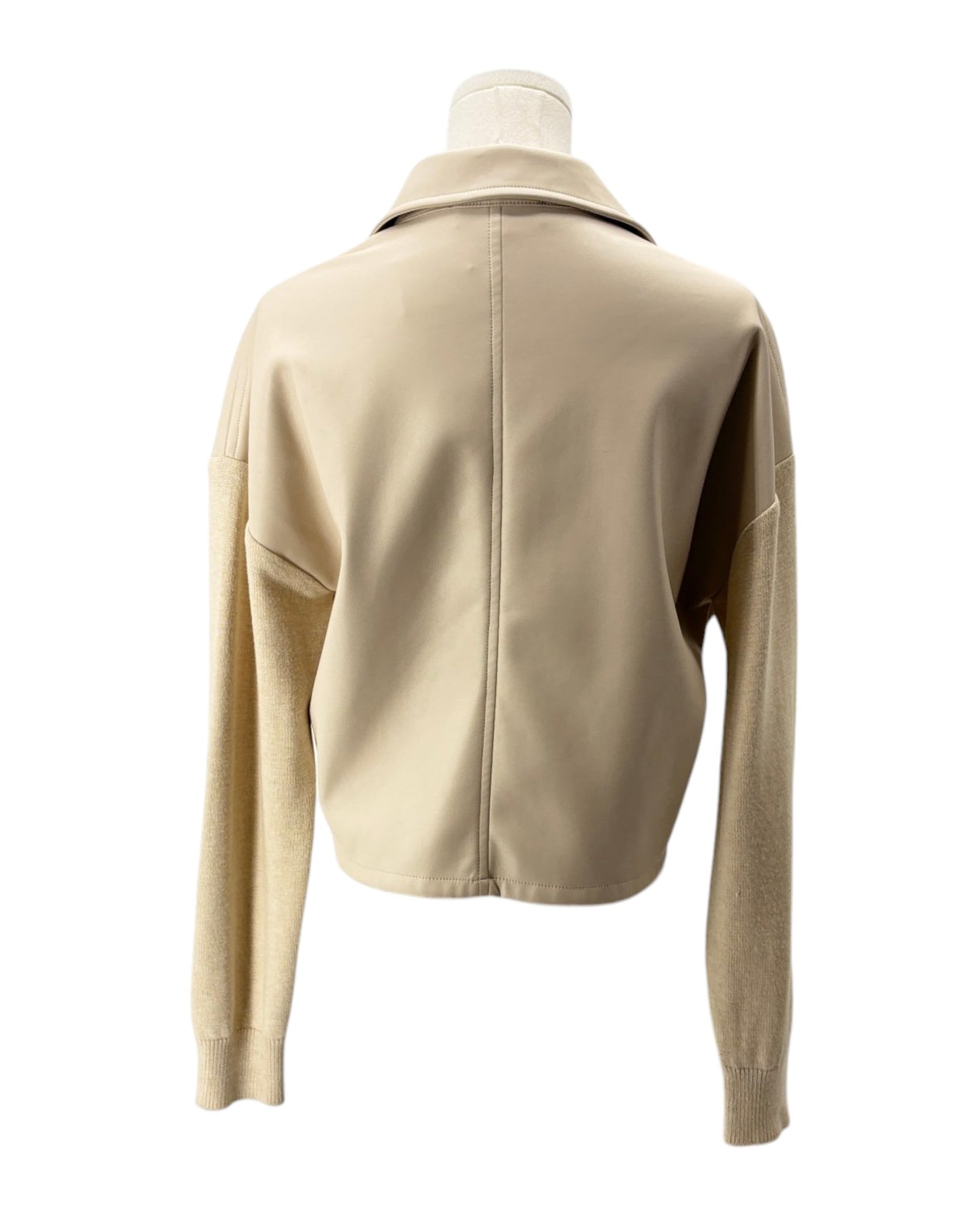 Beige jacket on a mannequin against a white background
