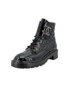 Black quilted leather boot with silver logo on a white background