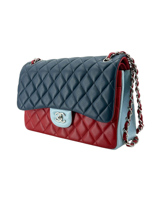 Quilted handbag with red and blue design on a white background