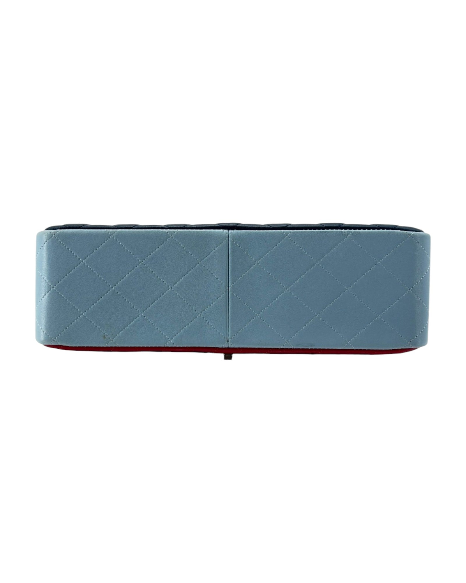 Blue handbag with a red interior on a white background