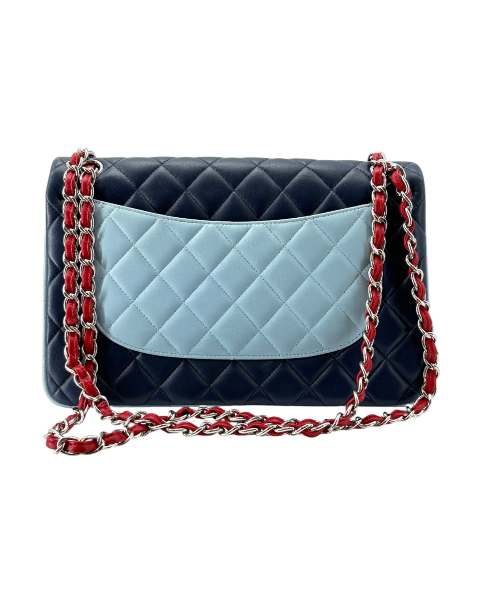 Quilted handbag with a blue section and red chain strap on a white background