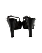 Black high-heeled shoes on a white background