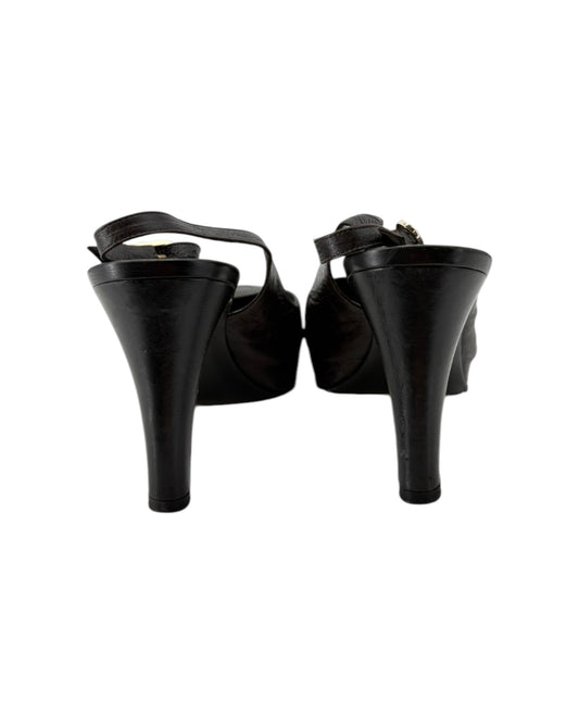 Black high-heeled shoes on a white background