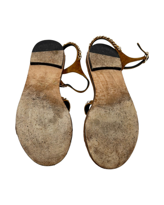 Pair of worn-out sandals on a white background