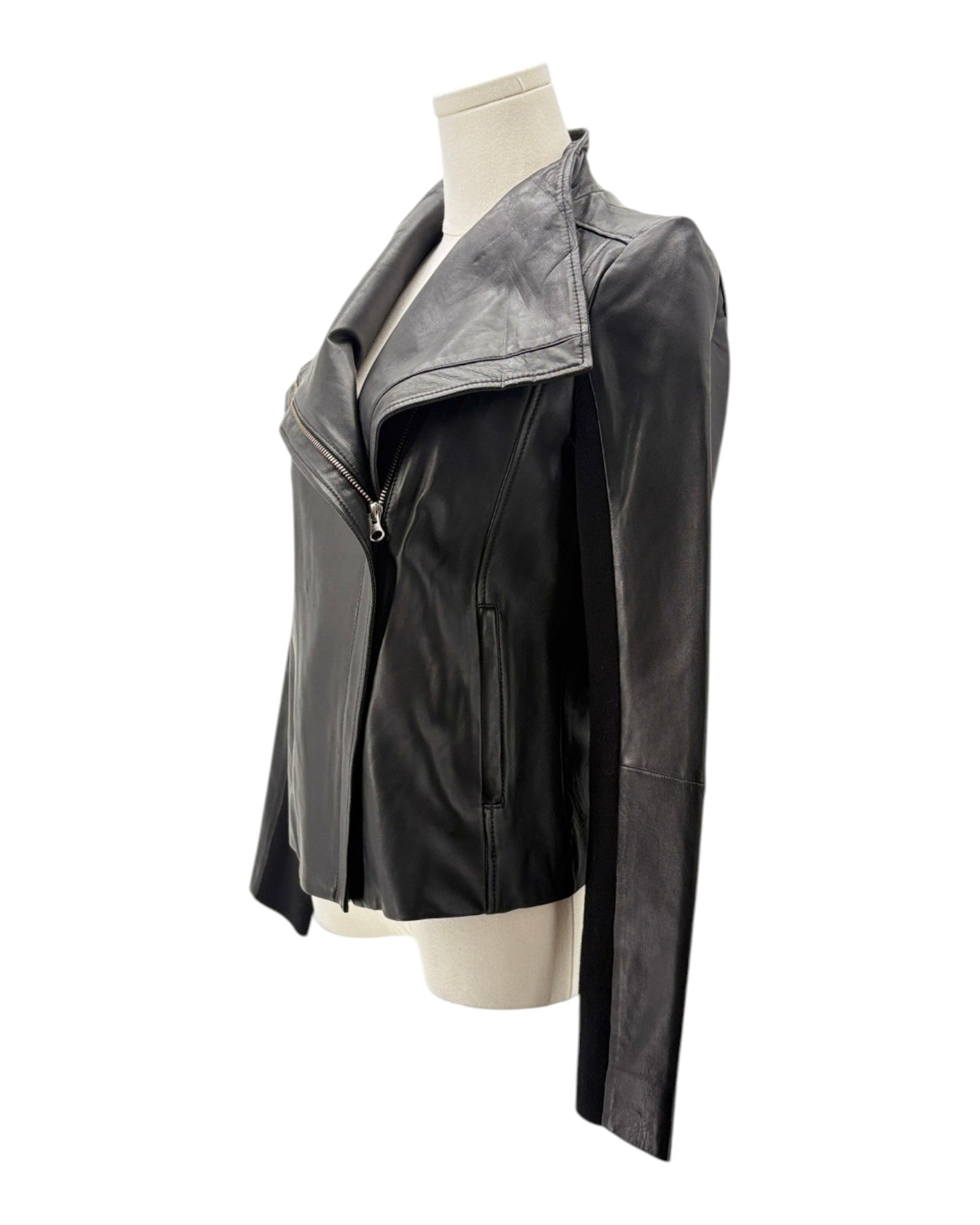 Black and gray jacket on a mannequin against a white background
