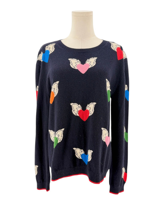 Navy blue sweater with colorful flying hearts pattern on a mannequin on a white background