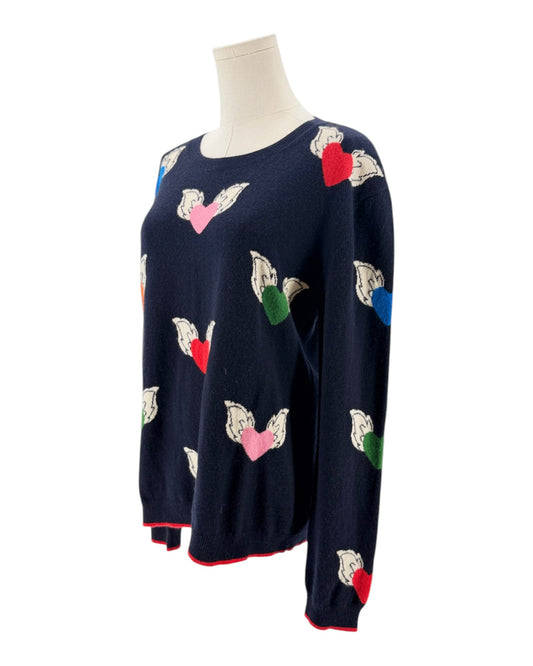 Navy blue sweater with colorful flying hearts pattern on a mannequin on a white background