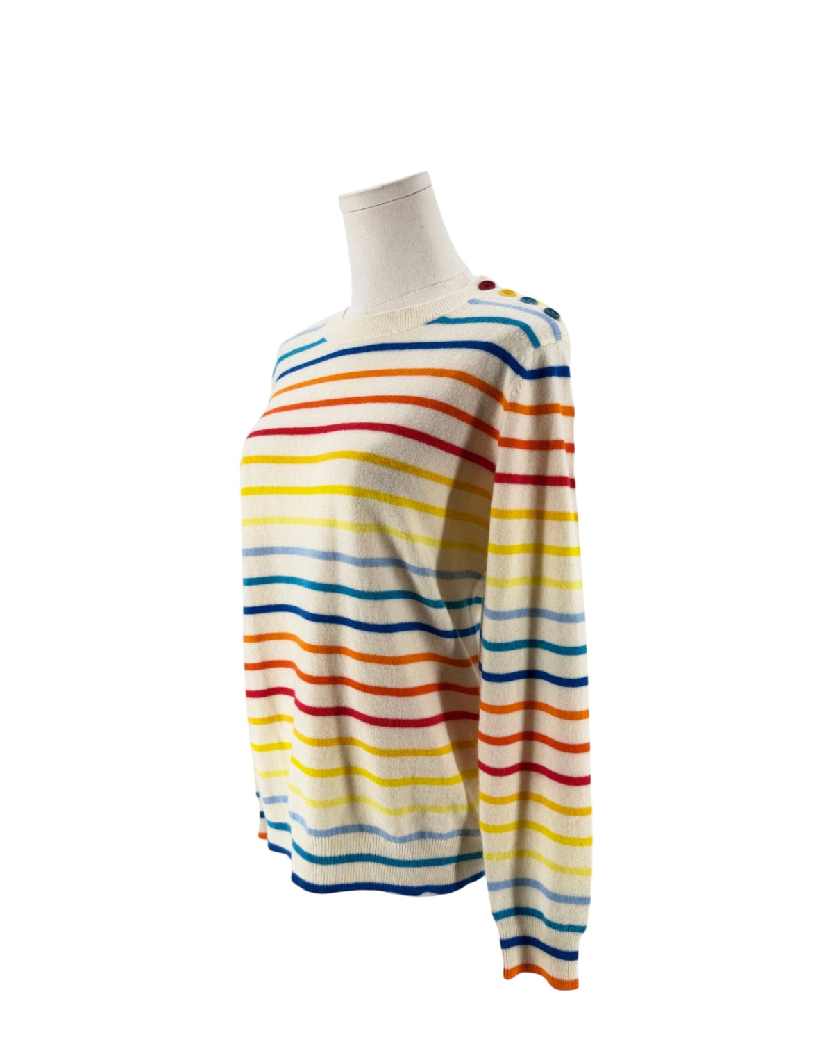 A long-sleeve knit sweater with horizontal rainbow stripes in blue, red, yellow, and orange on an off-white base, displayed on a mannequin torso against a white background.