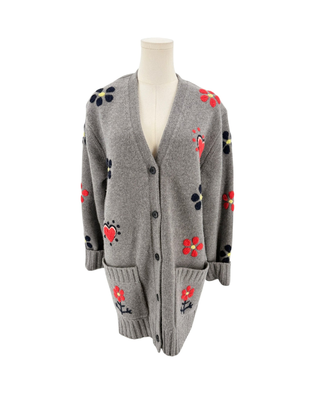 Grey button front cardigan with red floral and heart embroidery on a mannequin with a white background