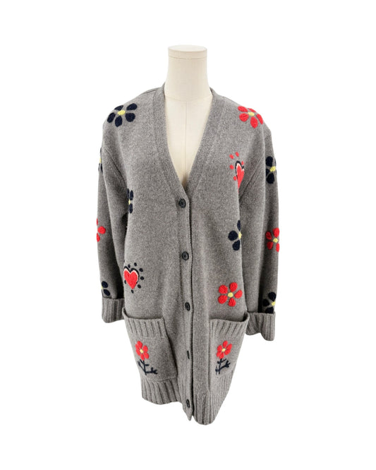 Grey button front cardigan with red floral and heart embroidery on a mannequin with a white background