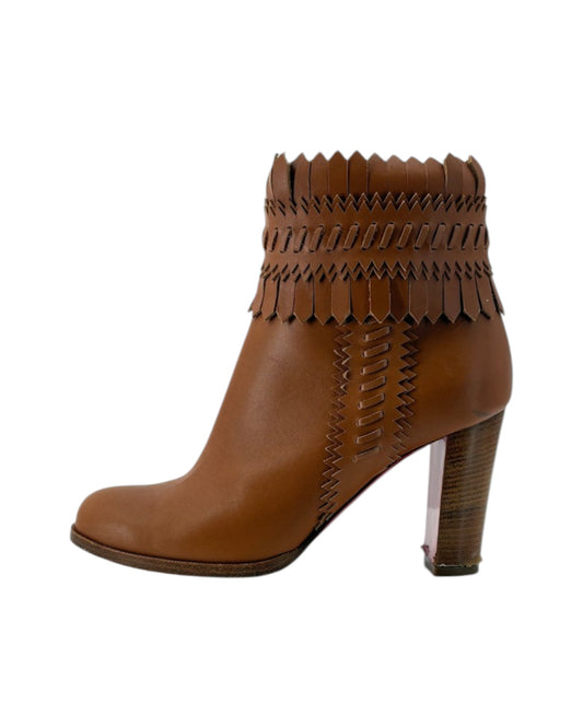 Brown ankle boot with fringe details on a white background