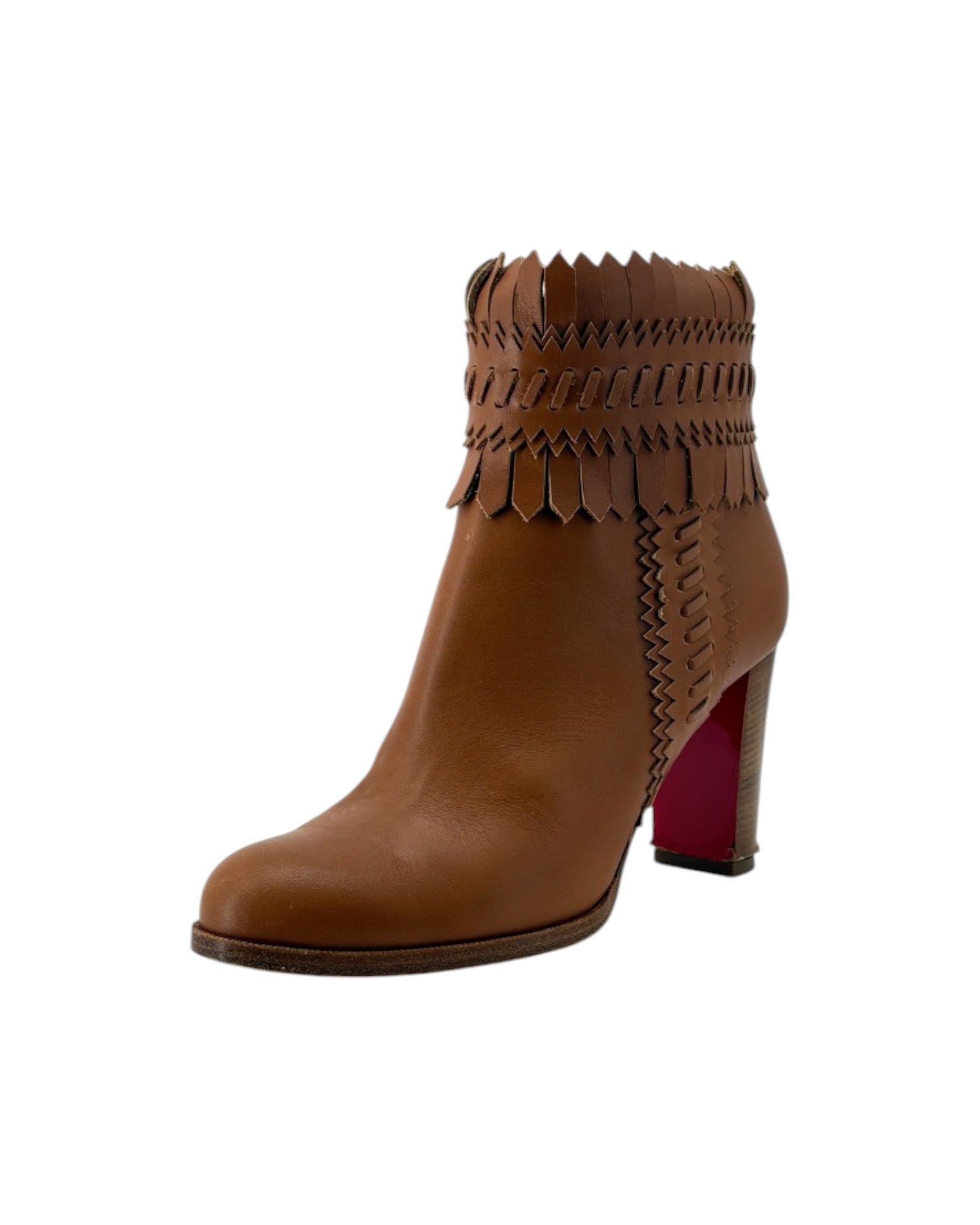 Brown ankle boot with decorative straps on a white background