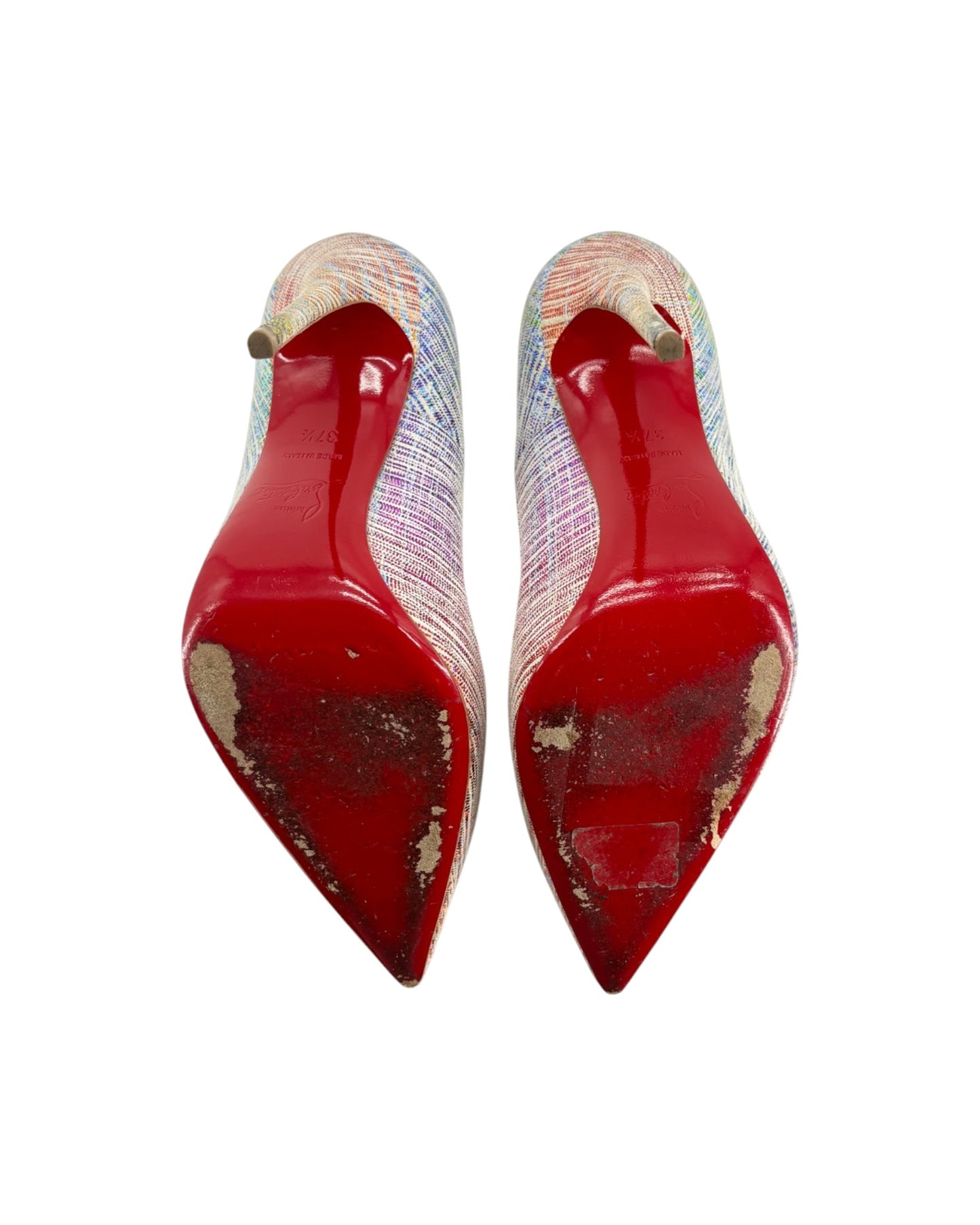 Pair of red high-heeled shoes with a patterned strap on a white background