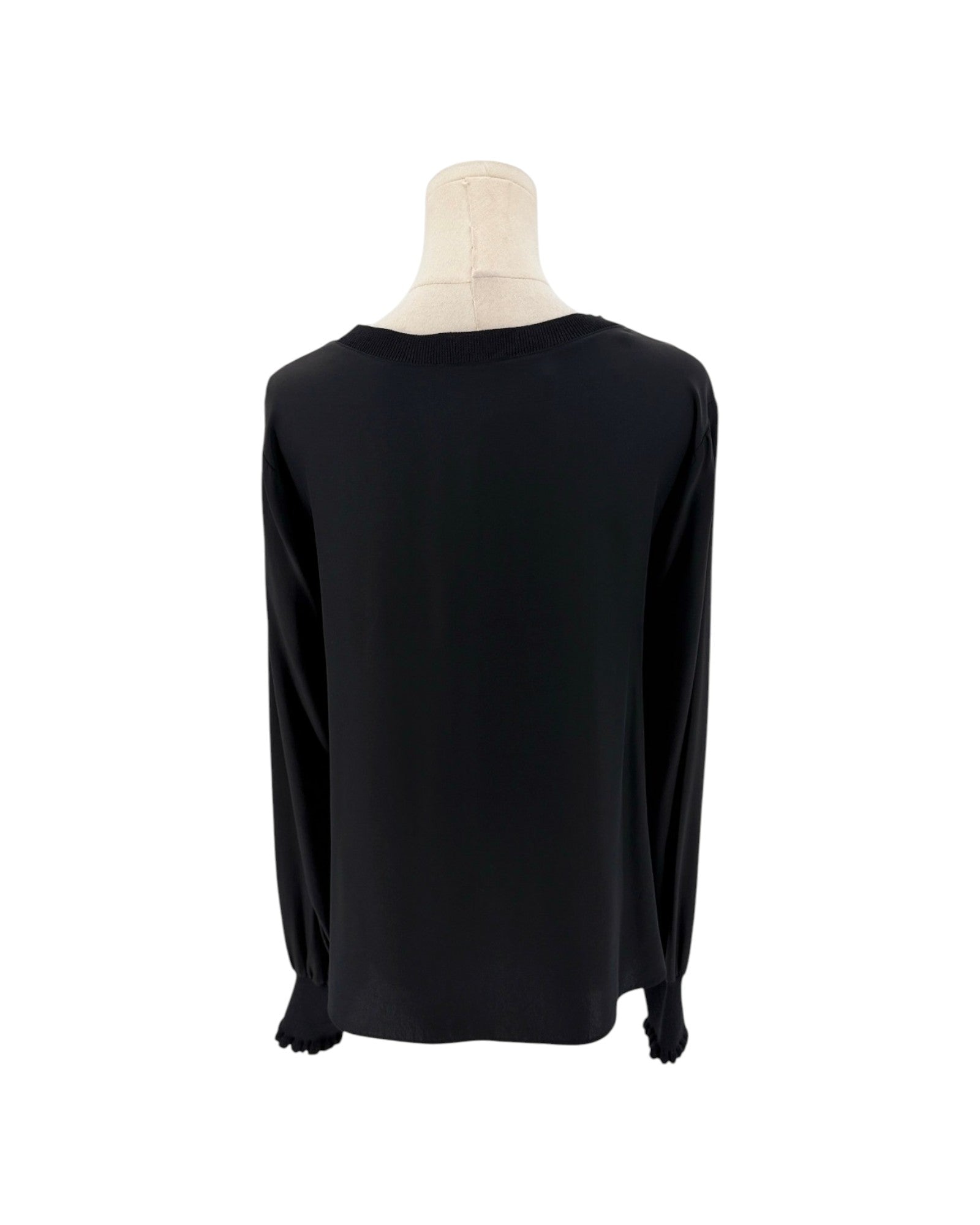 A black long-sleeve top displayed on a mannequin torso against a plain white background.