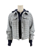 Houndstooth pattern jacket on a mannequin against a white background
