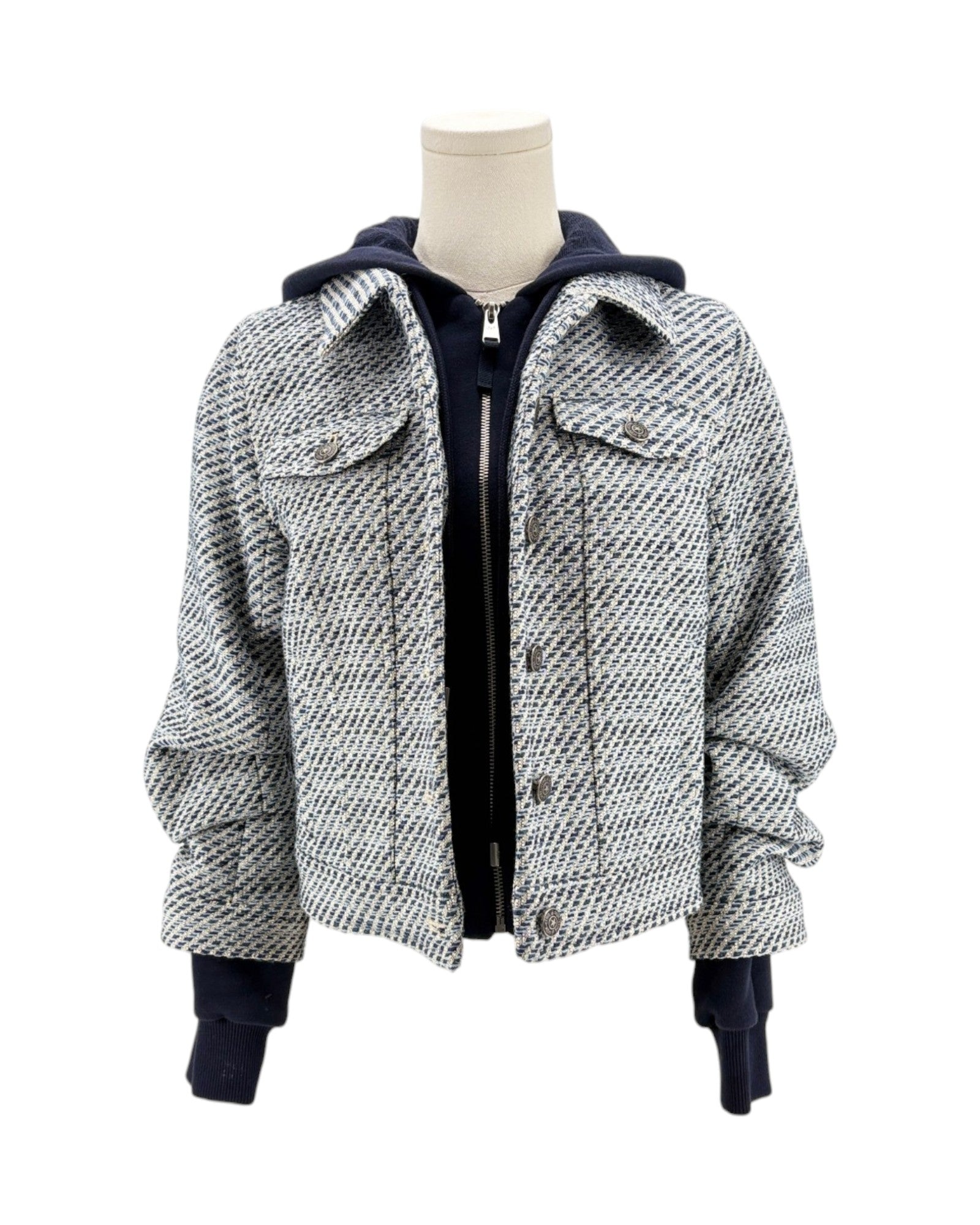 Houndstooth pattern jacket on a mannequin against a white background