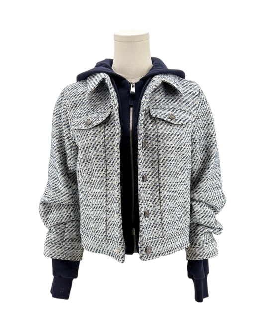 Houndstooth pattern jacket on a mannequin against a white background