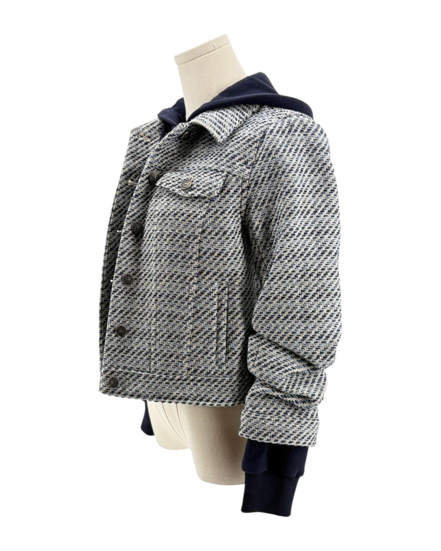 Houndstooth patterned jacket on a mannequin against a white background