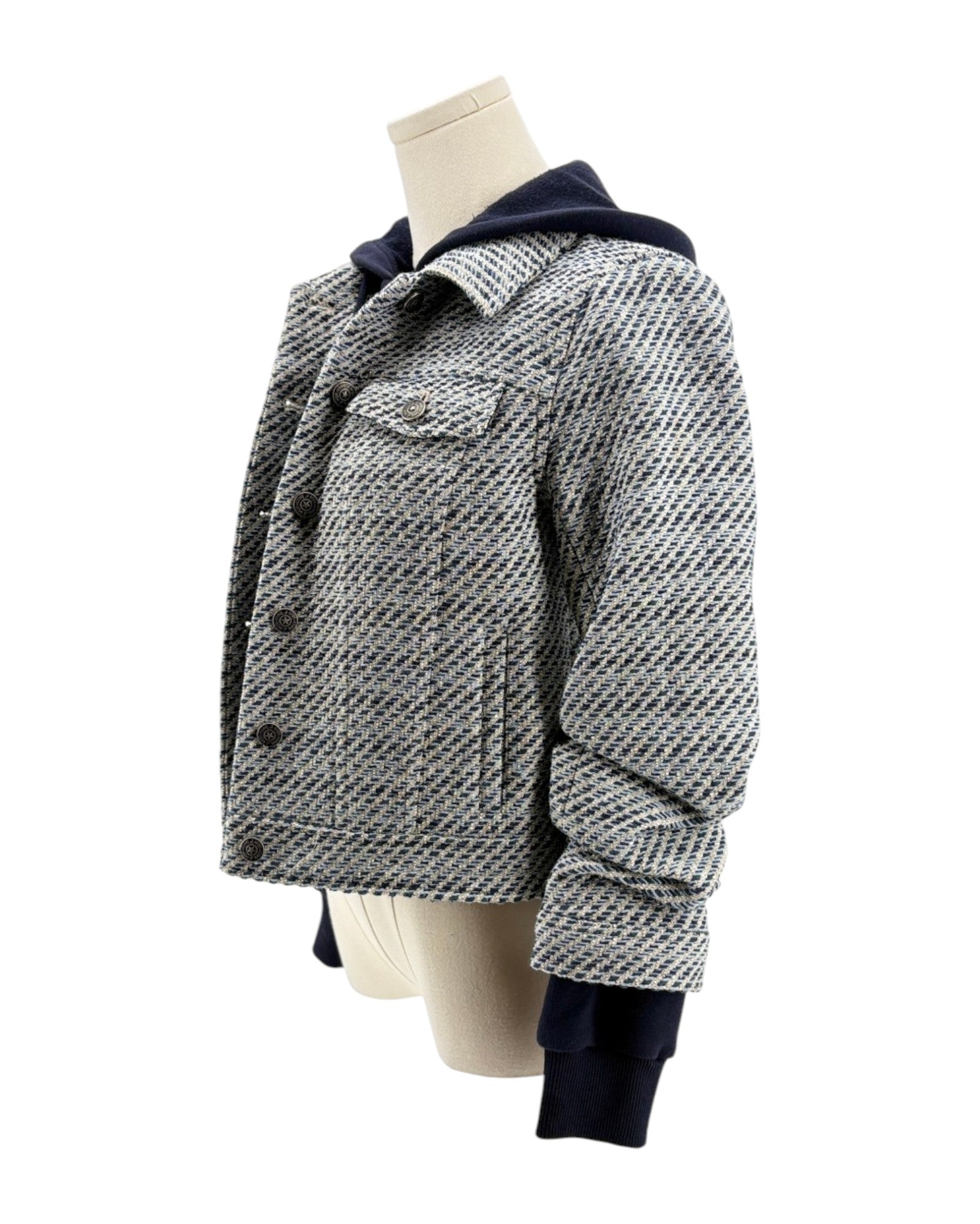 Houndstooth patterned jacket on a mannequin against a white background