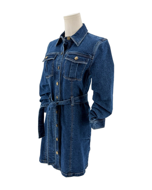 A blue denim shirt dress with a matching waist tie belt, displayed on a mannequin torso against a plain white background.